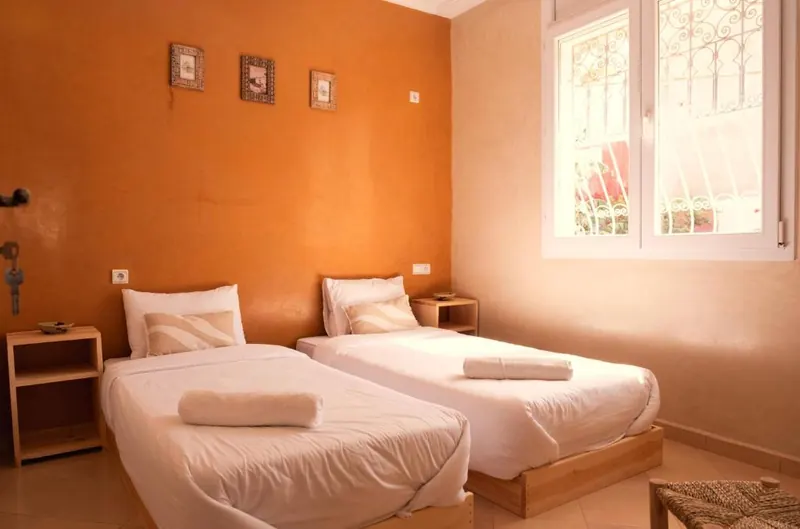 Shared room with two single beds at NAVA surf camp near Taghazout
