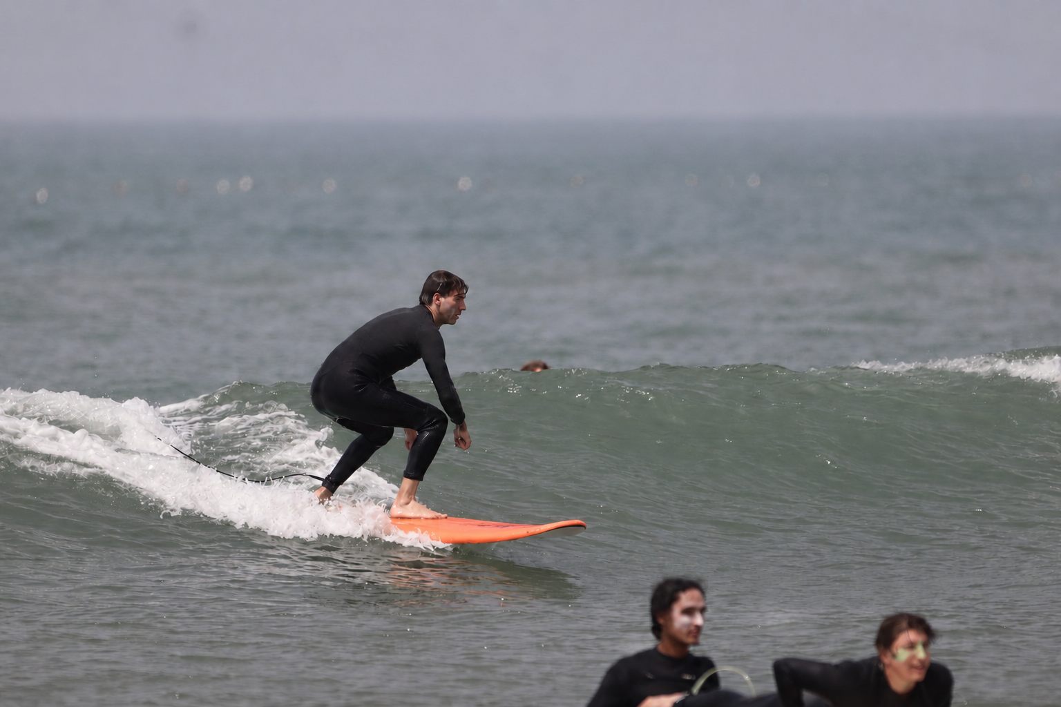 Surfer riding a wave off Tamraght